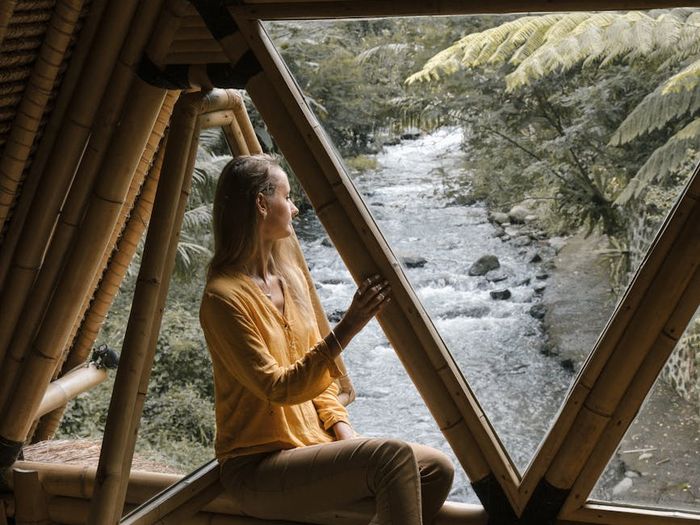 A serene landscape view from a window, symbolizing peace.